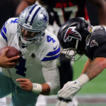 ATLANTA, GA - NOVEMBER 03: Dallas Cowboys quarterback Dak Prescott #4 is tackled during Sunday afternoon's NFL game between the Atlanta Falcons and the Dallas Cowboys on November 3, 2024 at Mercedes-Benz Stadium in Atlanta, Georgia. (Photo by David J. Griffin/Icon Sportswire via Getty Images)